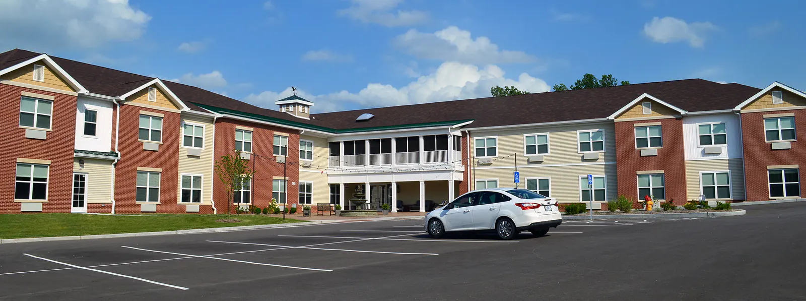 A car sits in a parking lot outside Pine Valley Assisted Living in Arnold, MO